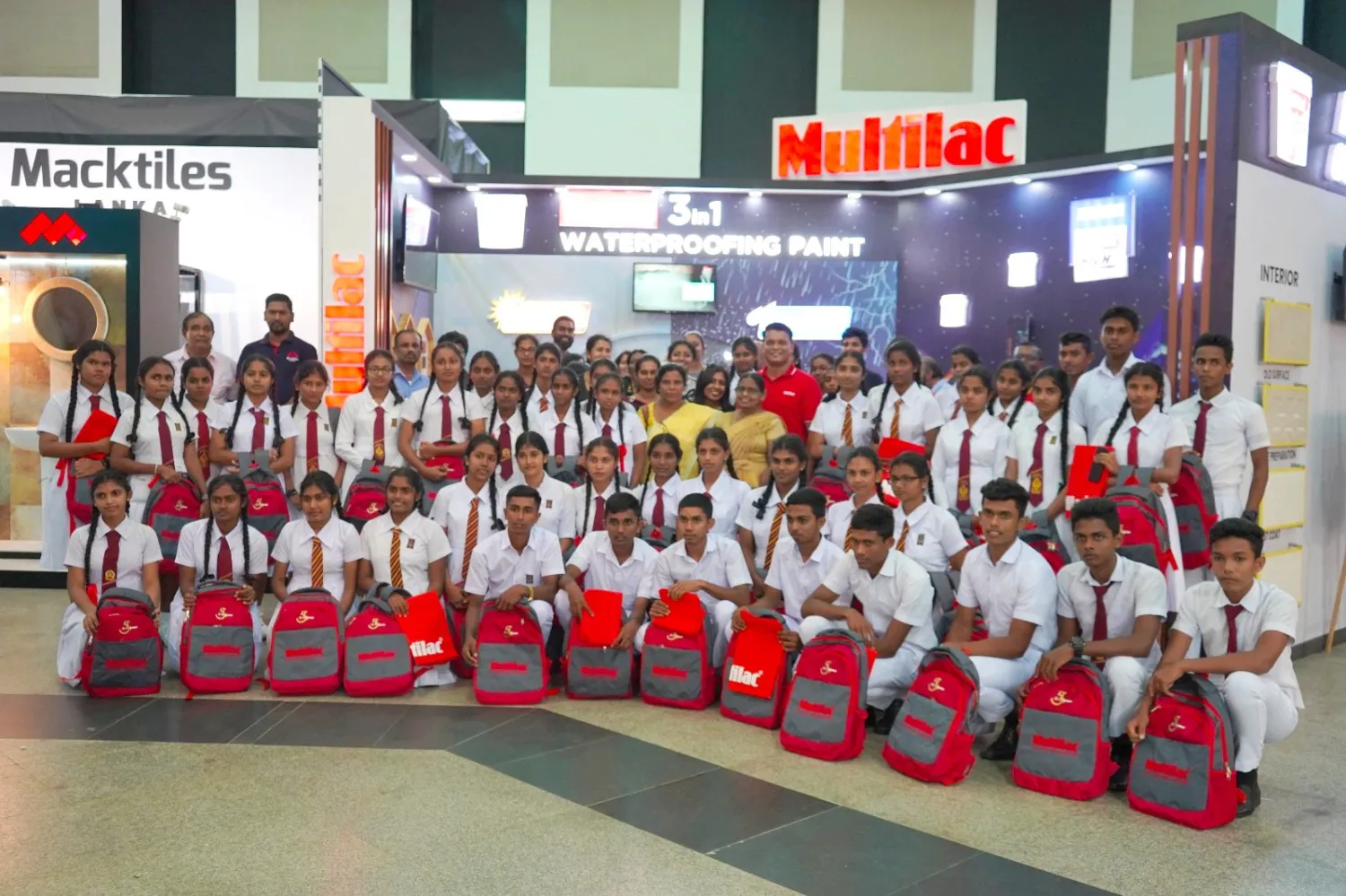 School bags and exercise books giveaway during the Architect Exhibition Image